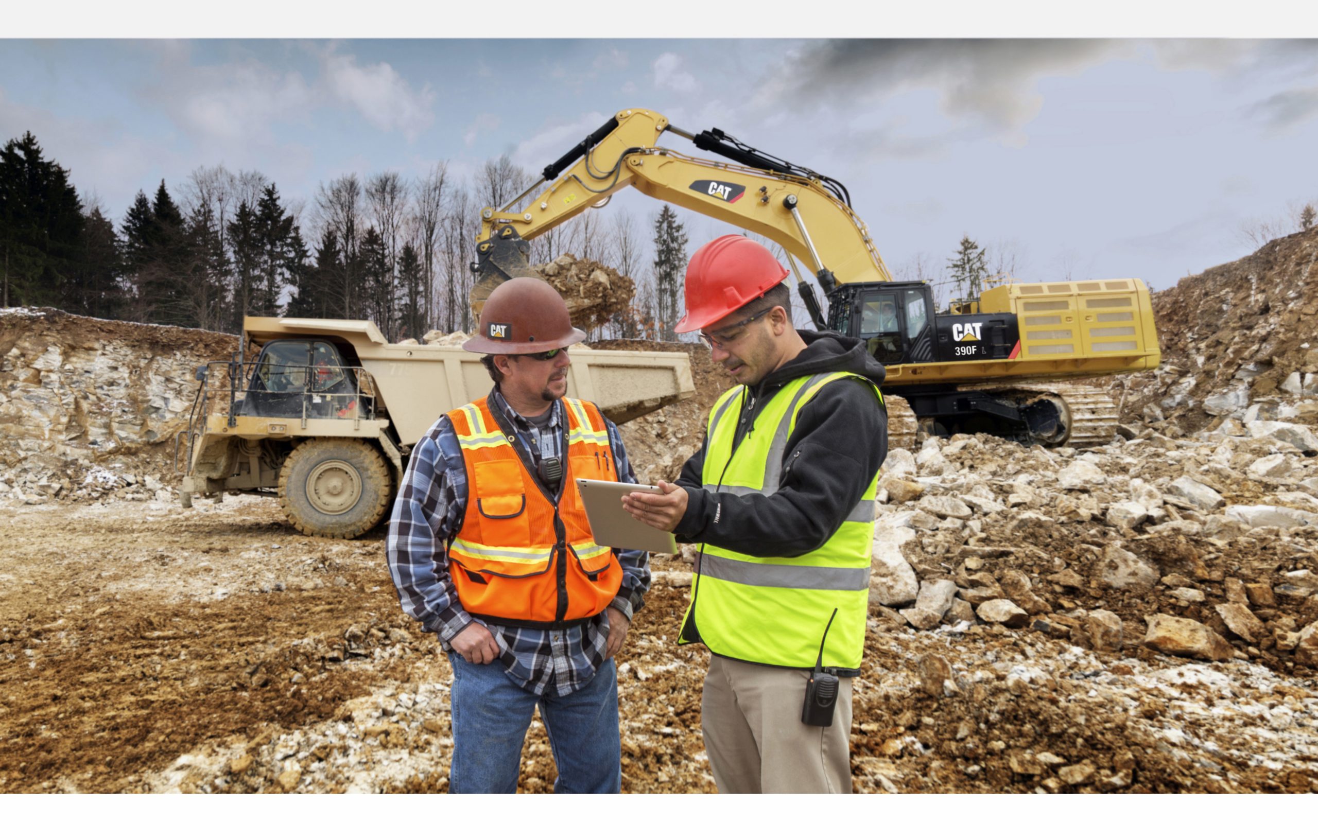 Two Construction Workers using the Cat App on site
