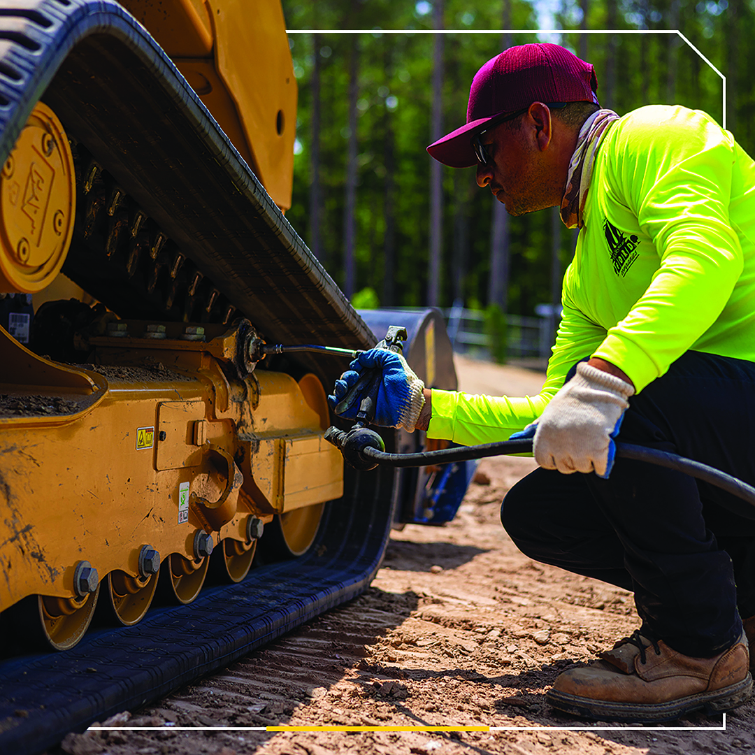 Man working on a Cat machine