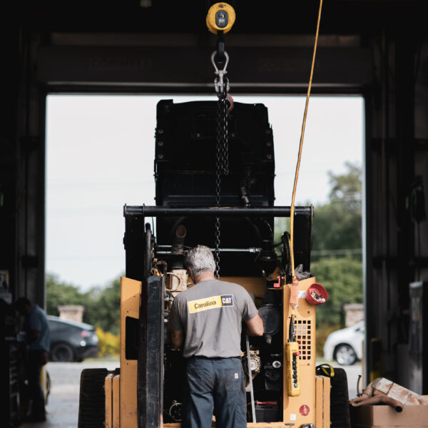 technician working on compact at the shop