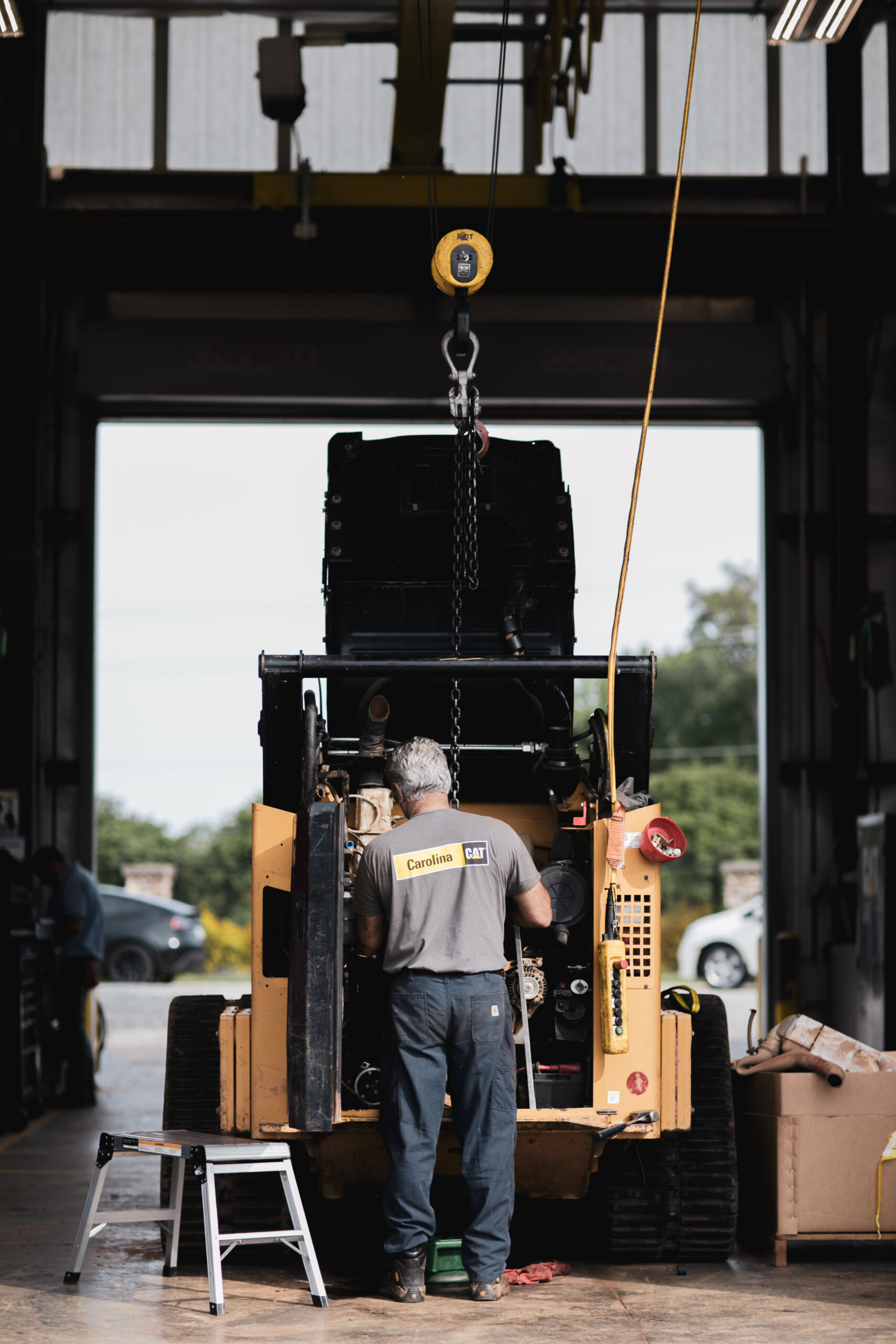 technician working on compact at the shop